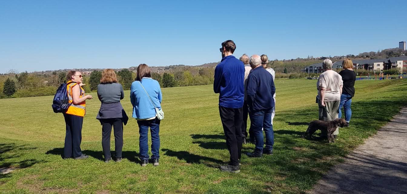 Walking group stopped on russells hall park